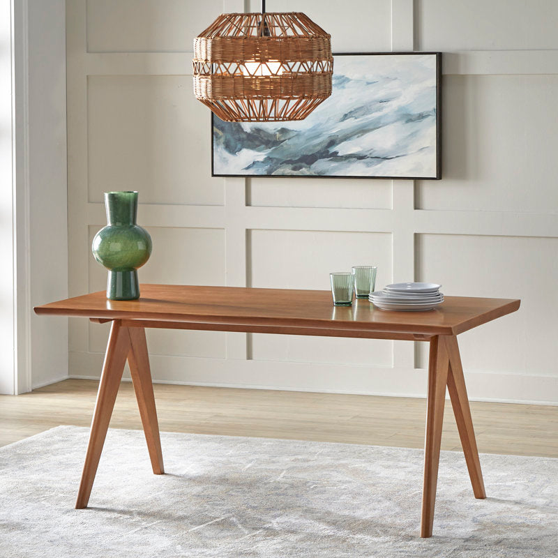 Contemporary teak dining table with natural cane back chairs