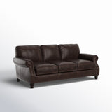 Classic dark brown leather sofa made from solid teak wood