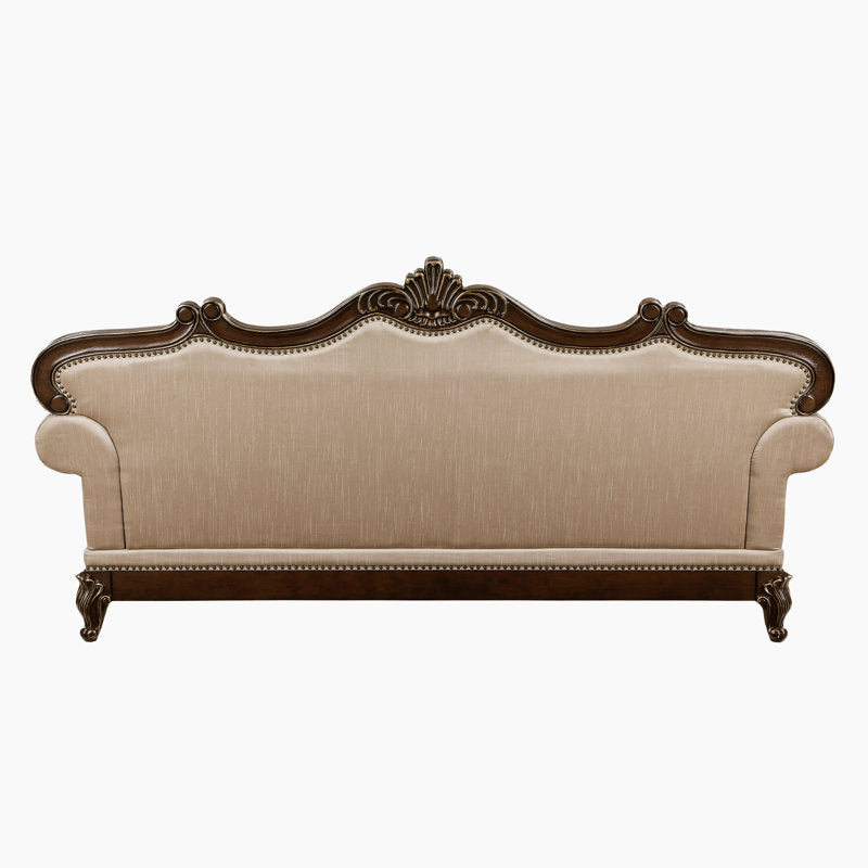 Elegant luxury sofa with tufted backrest and carved wooden frame