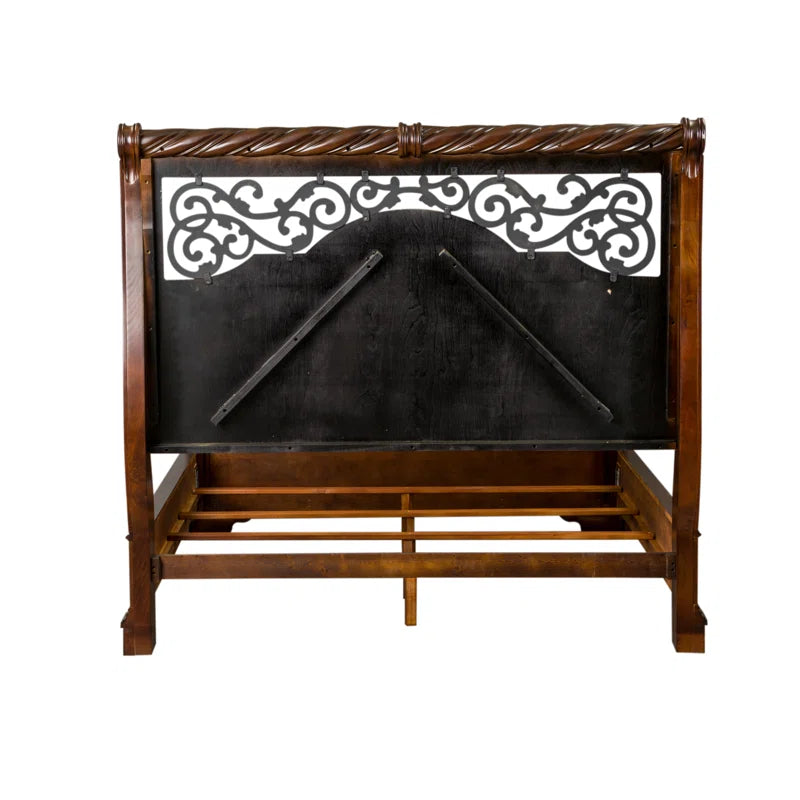 Queen size wooden sleigh bed with intricate details