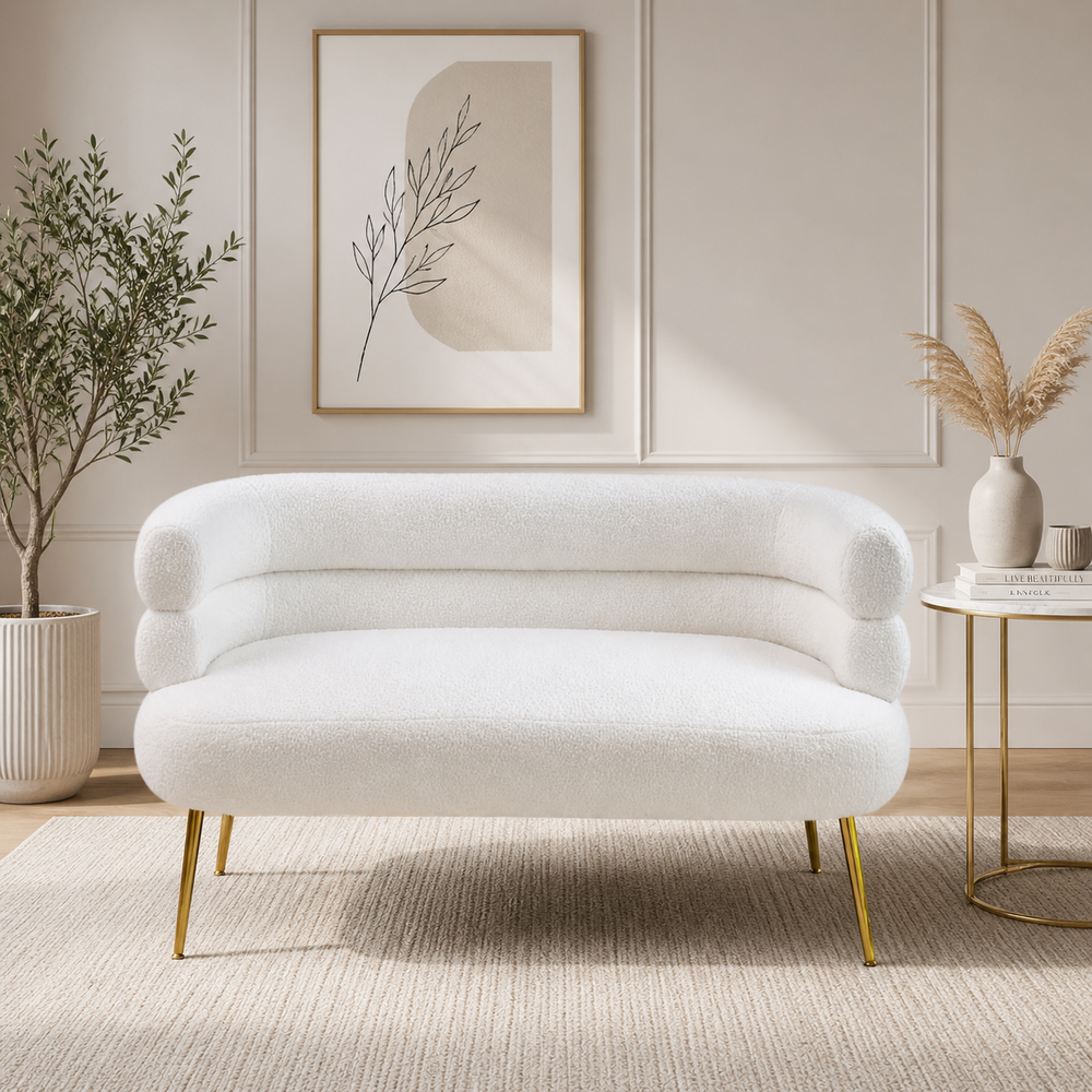 White bouclé curved loveseat sofa with teak wood frame and gold legs