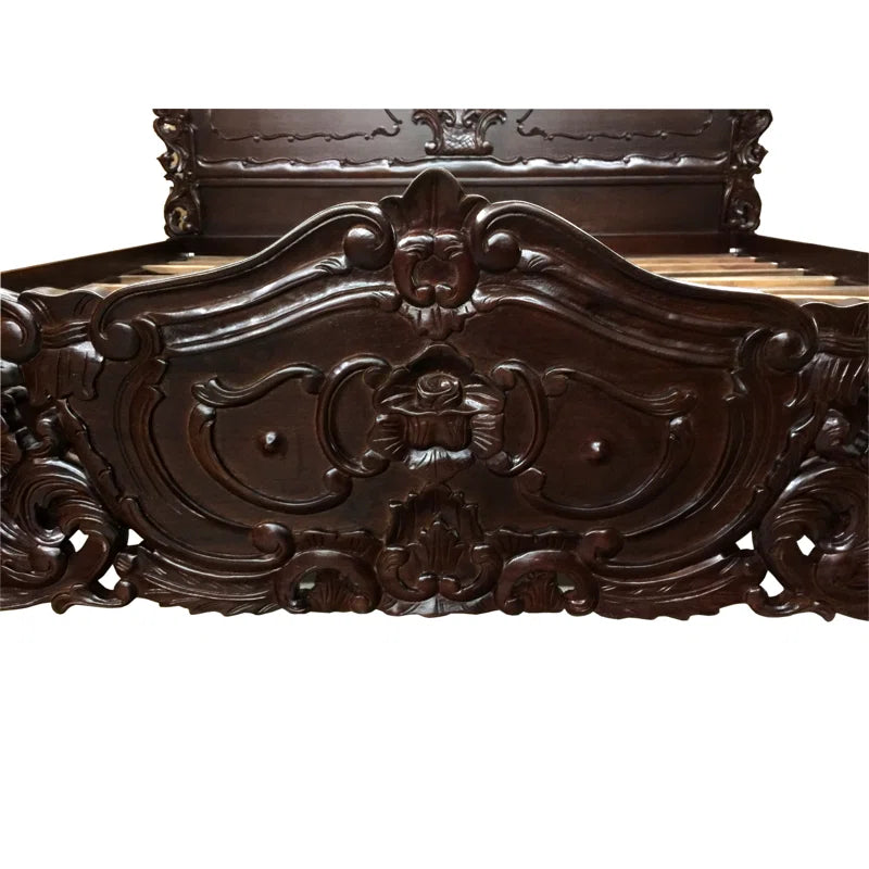 Antique style wooden bed with detailed carvings