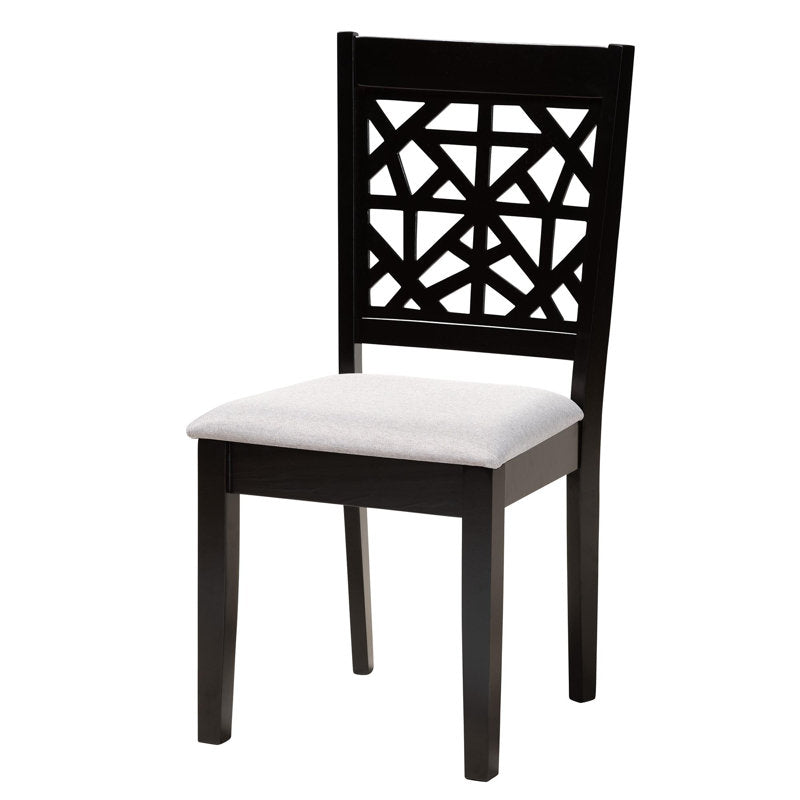 Space-saving round dining table with four padded chairs