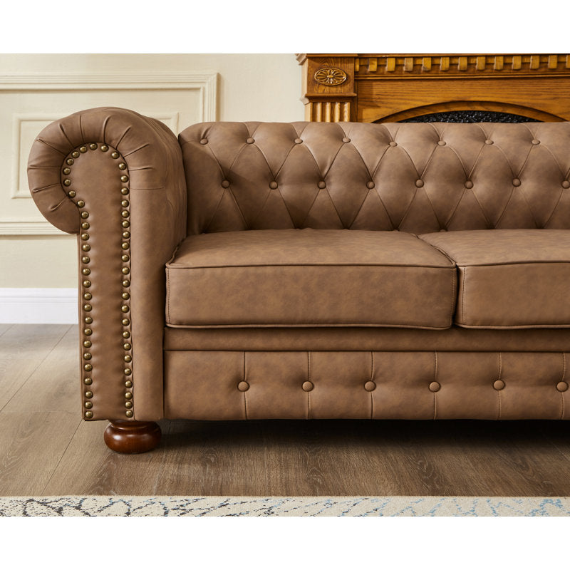Handcrafted teak wood Chesterfield sofa in elegant interior setting