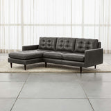 Modern tufted sectional sofa with teak wood frame and chaise seating.