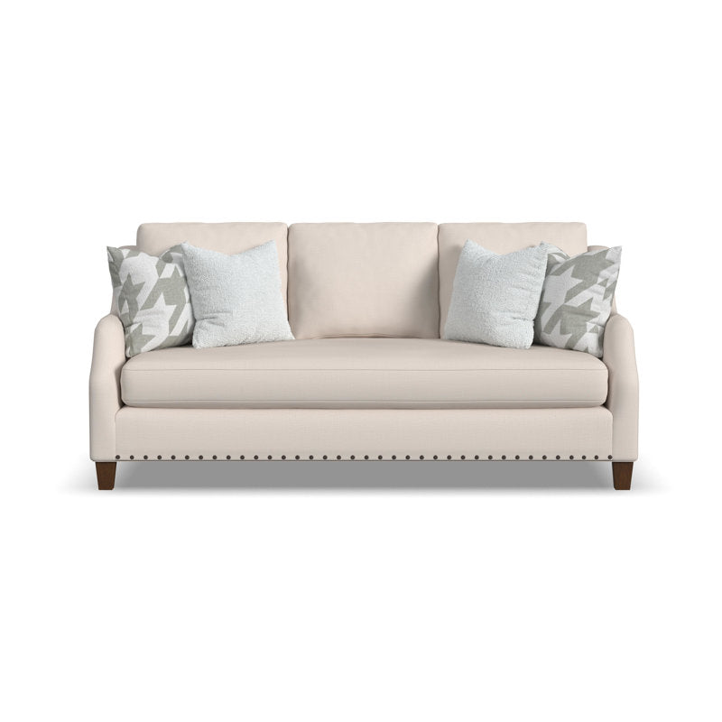 Elegant cream fabric loveseat with solid teak wood frame