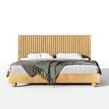Scandinavian style bed frame with natural wood finish
