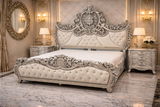 Royal king size bed front view with tufted upholstered headboard and ornate floral carving