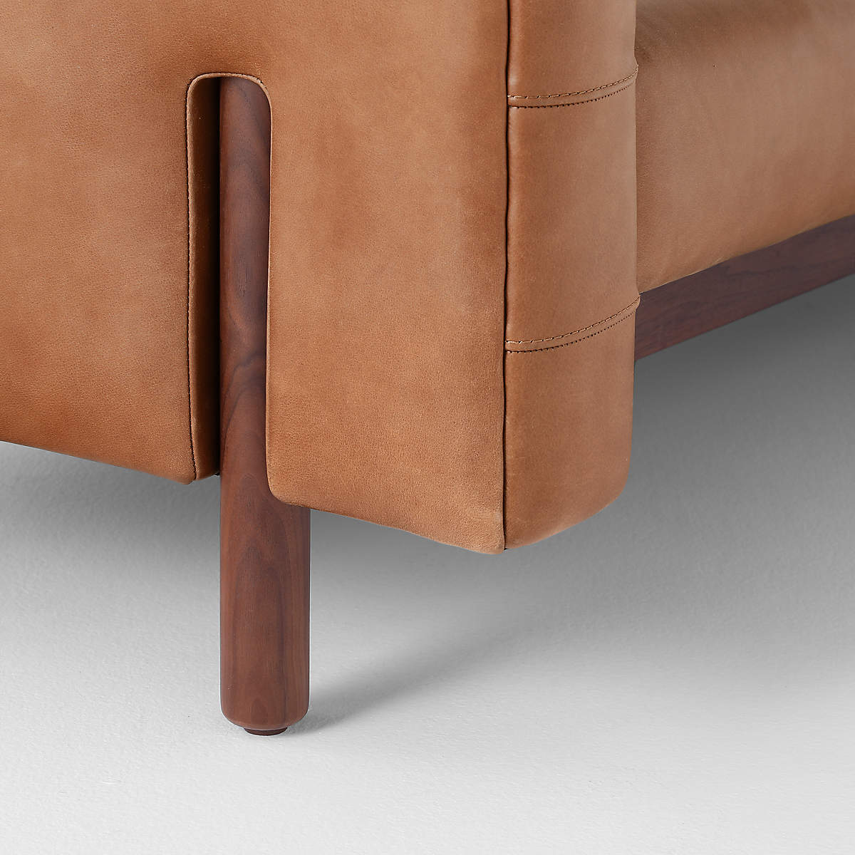 Elegant leather upholstered teak wood sofa