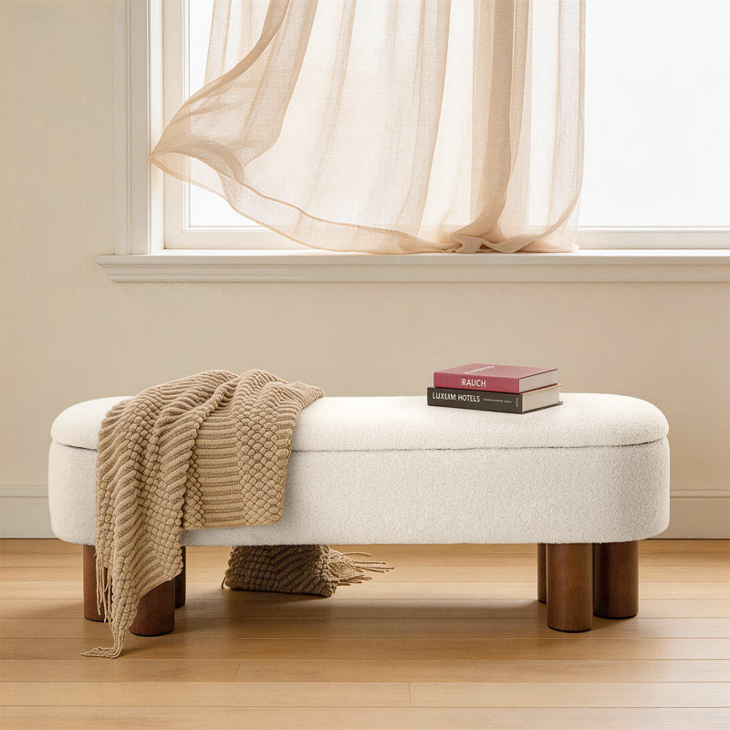 Upholstered bedroom bench in cream bouclé fabric