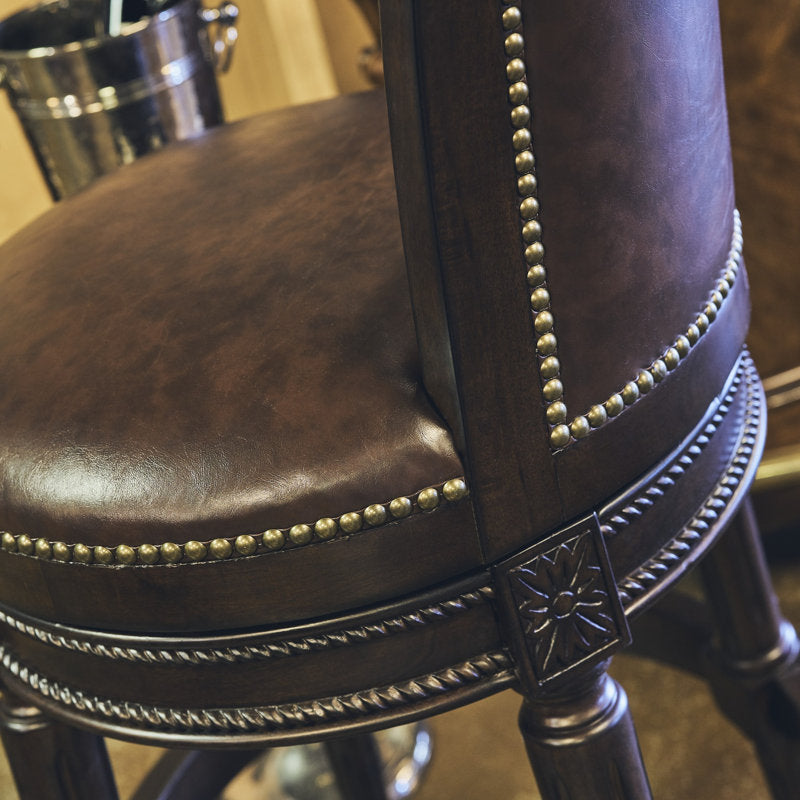Brown leather swivel bar stools with circular footrest