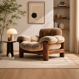 Luxury teak wood lounge chair with plush beige upholstery in modern living room.