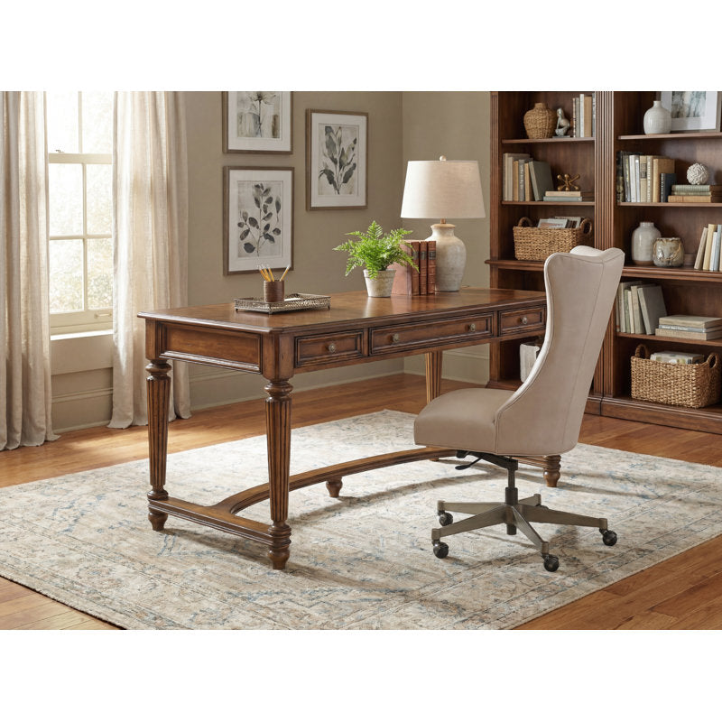 Classic executive desk with three drawers and fluted wooden legs