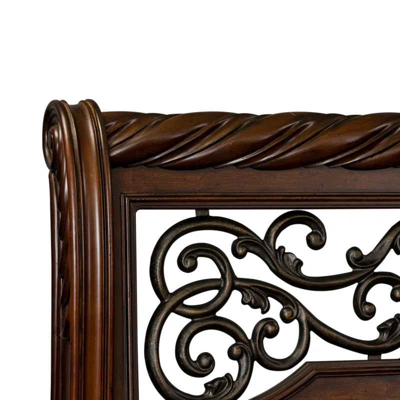 Elegant carved wood bed frame with footboard