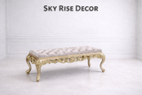 Elegant gold carved bench with tufted upholstered seat for entryway décor
