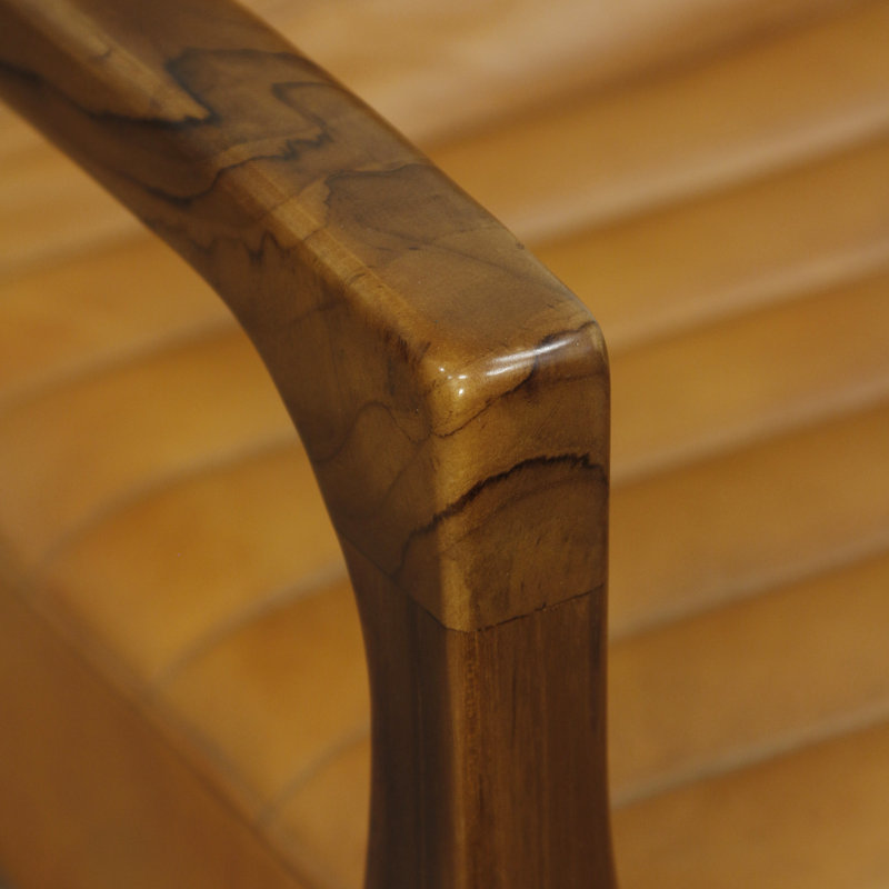 Handcrafted teak wood armchair with cushioned leather seat and backrest