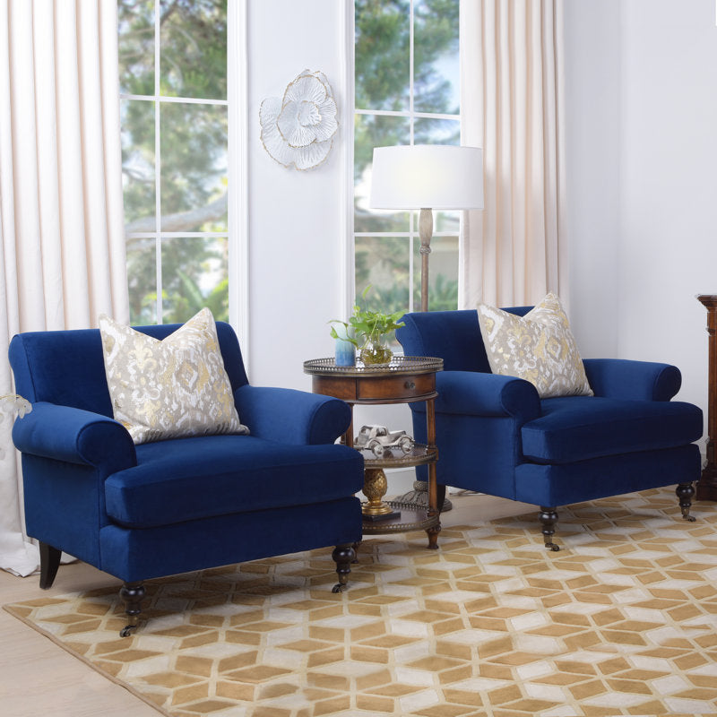 Elegant royal blue reading chair with rolled arms
