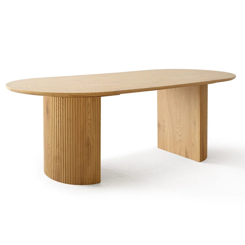 Modern pedestal dining table with upholstered seating
