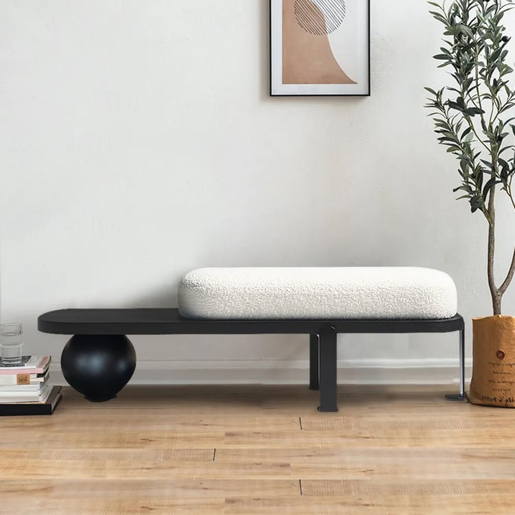 Minimalist black wooden bench with white upholstery