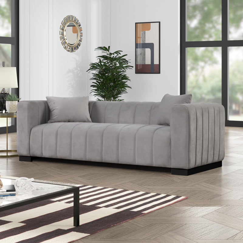 Grey upholstered teak wood sofa set with modern channel tufting