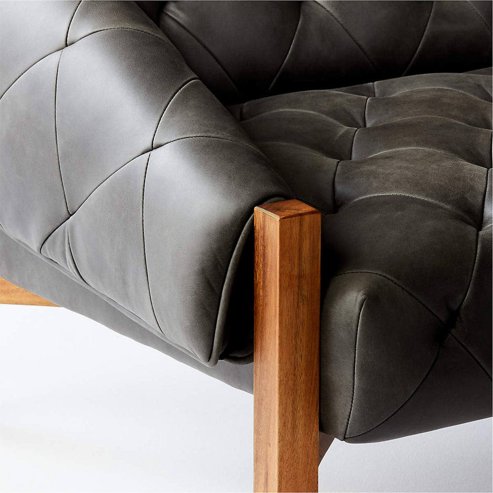 Designer lounge chair with wooden frame and tufted back