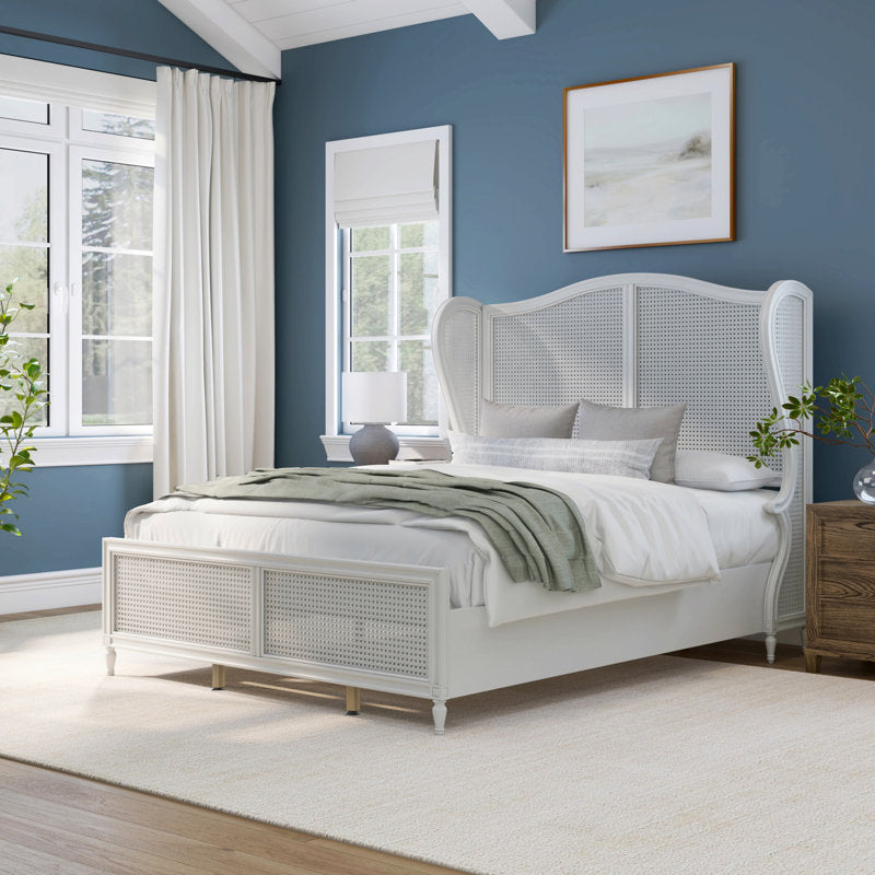 white wooden bed with woven headboard