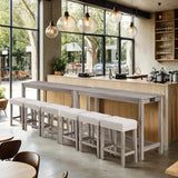 Modern teak wood dining table with upholstered stools