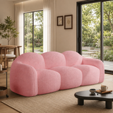 Pink bouclé cloud sofa in modern living room