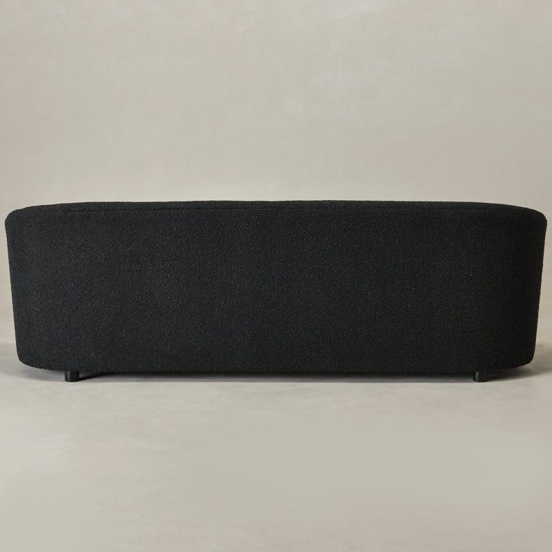 Designer black bouclé sofa with solid teak wood structure
