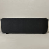 Designer black bouclé sofa with solid teak wood structure