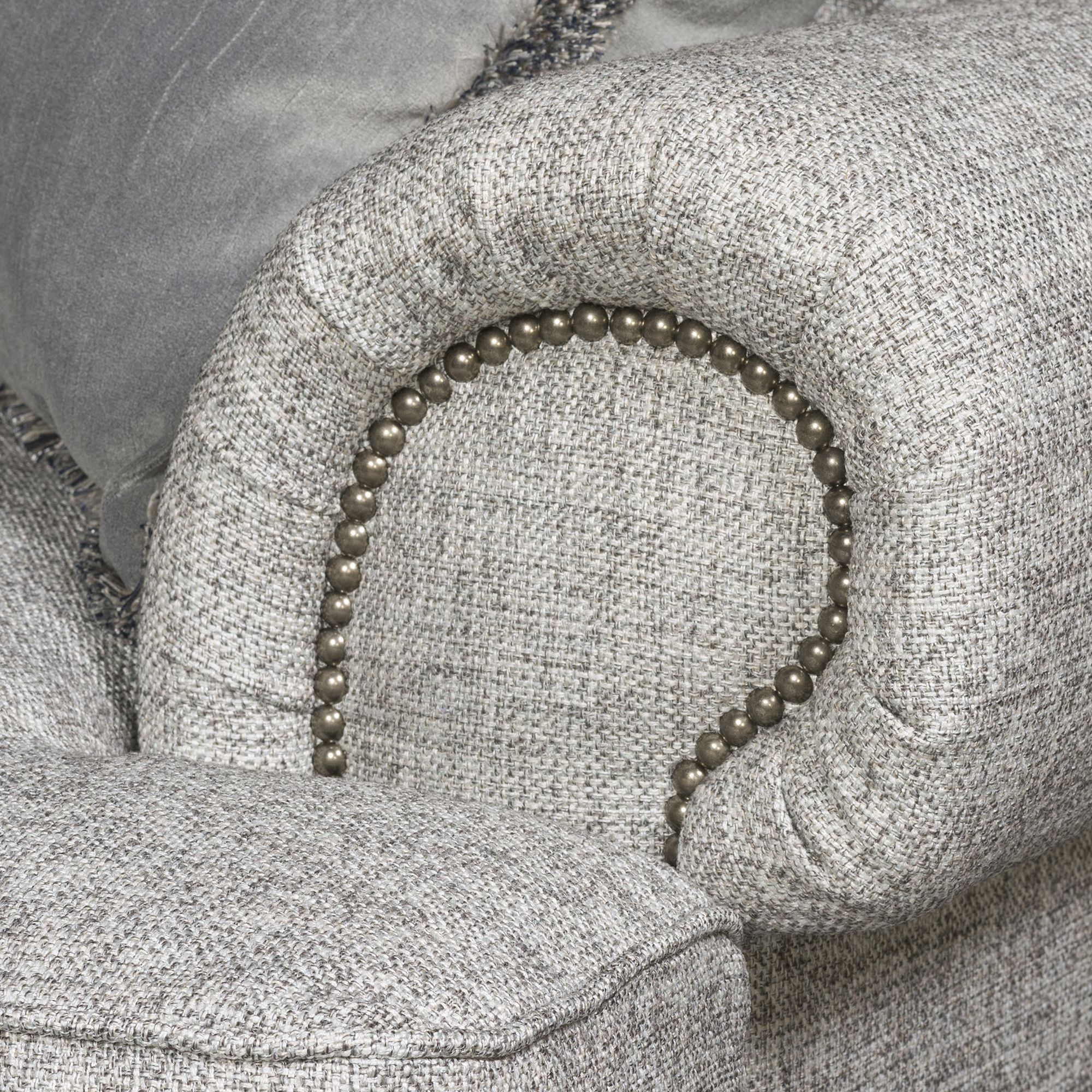 "Modern classic fabric sofa with nailhead detailing"