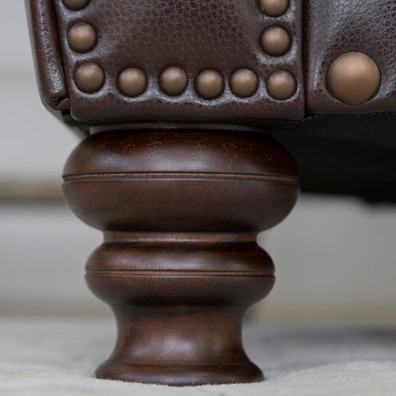 Solid teak wood sofa with rolled arms and nailhead trim