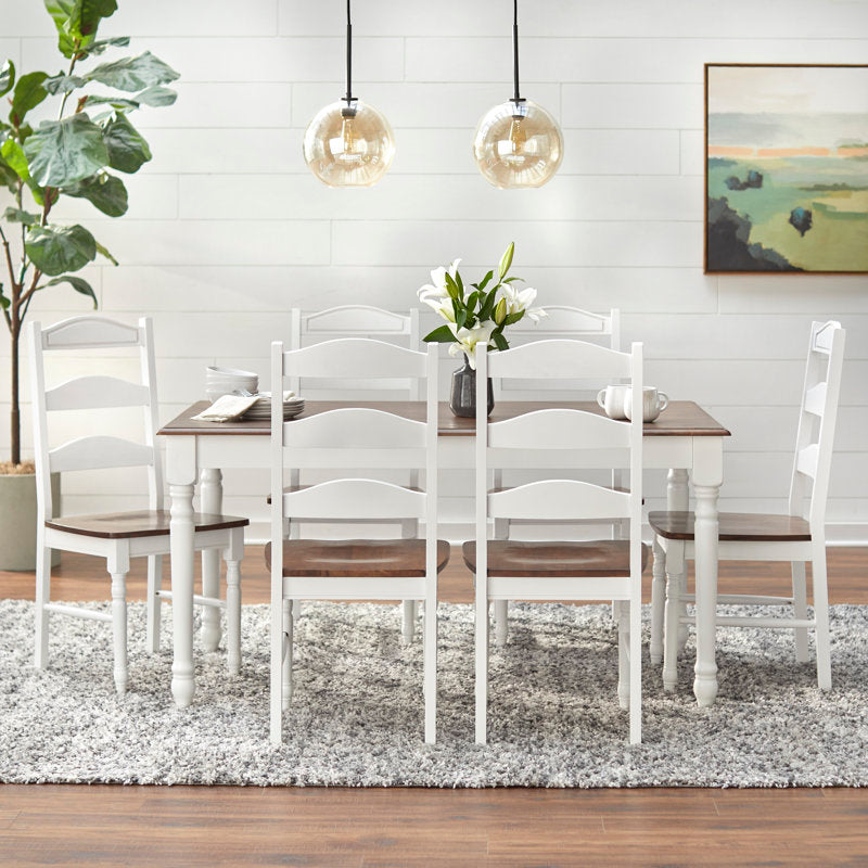 White dining table and chairs crafted from teak wood