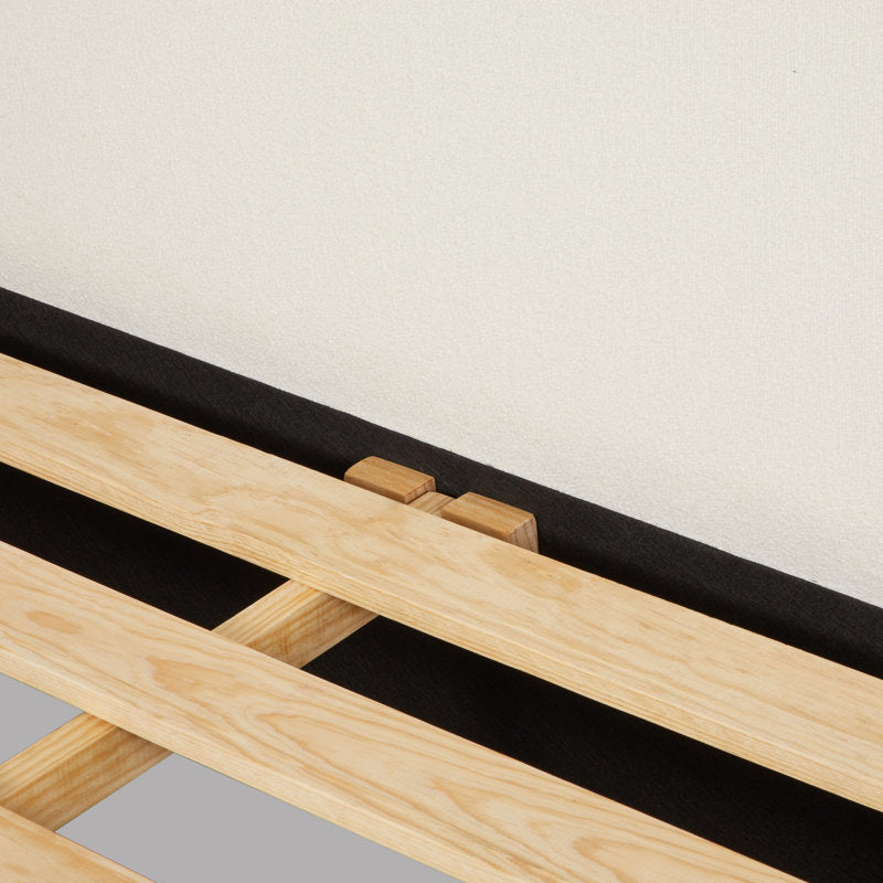 Minimalist upholstered platform bed with curved design