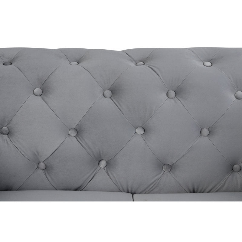 Handcrafted velvet sofa with deep button tufting