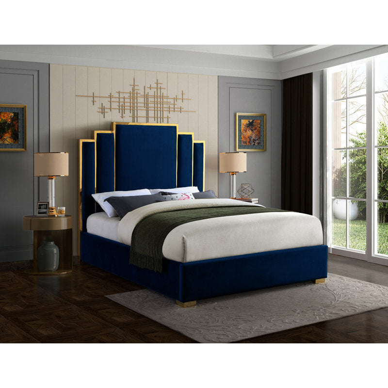 Modern teak wood bed with geometric wingback headboard in blue velvet.