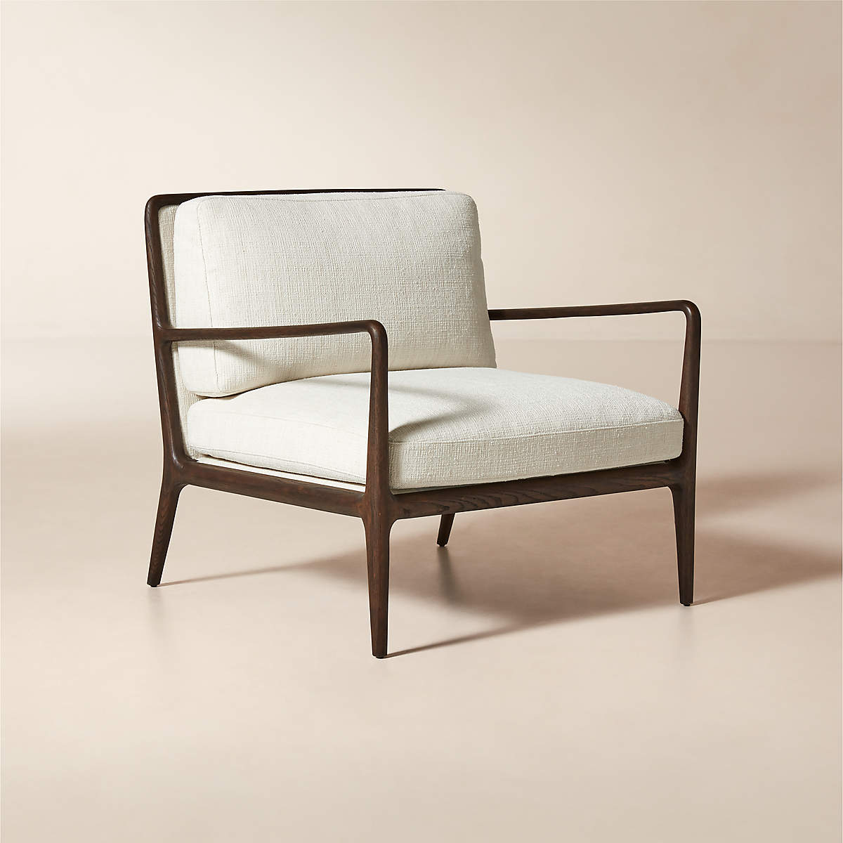 Contemporary upholstered teak armchair