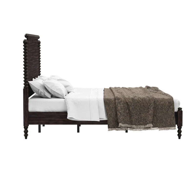 ​Close up detail of turned spindle posts on dark walnut bed frame