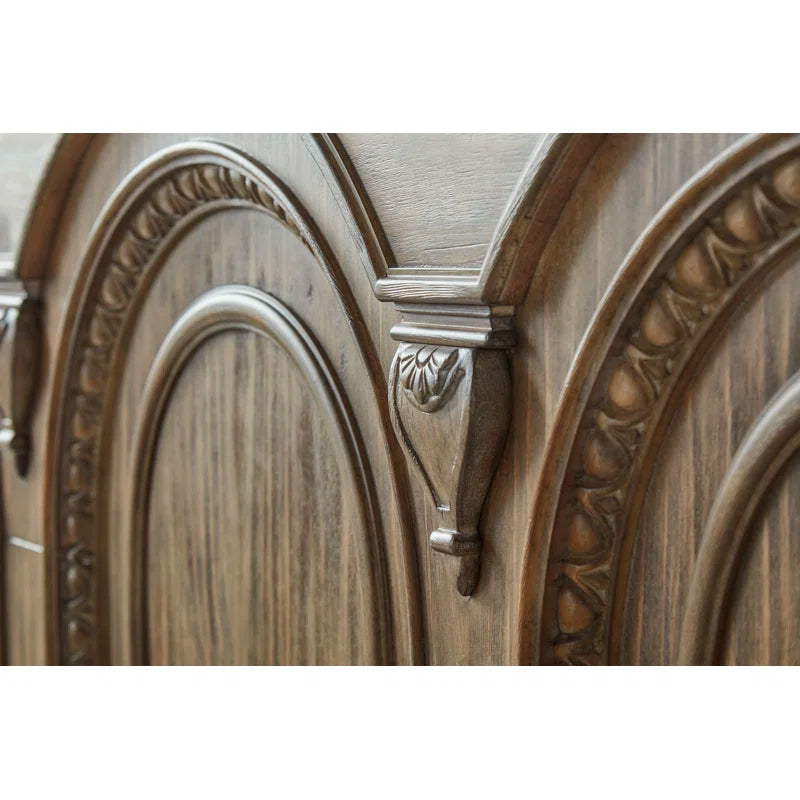 Classic wooden bed with arched headboard design