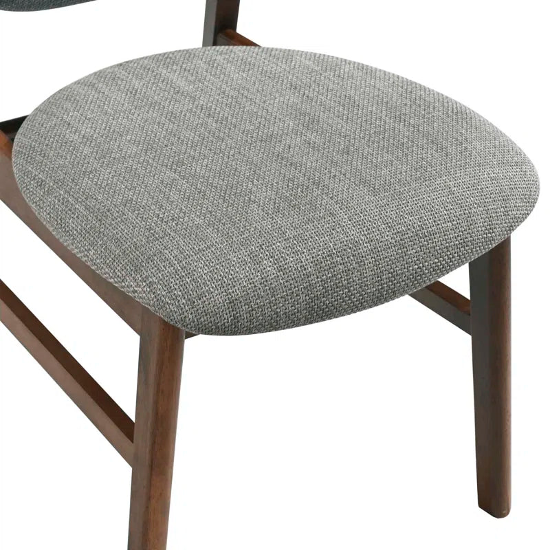 wooden dining table with grey cushioned chairs
