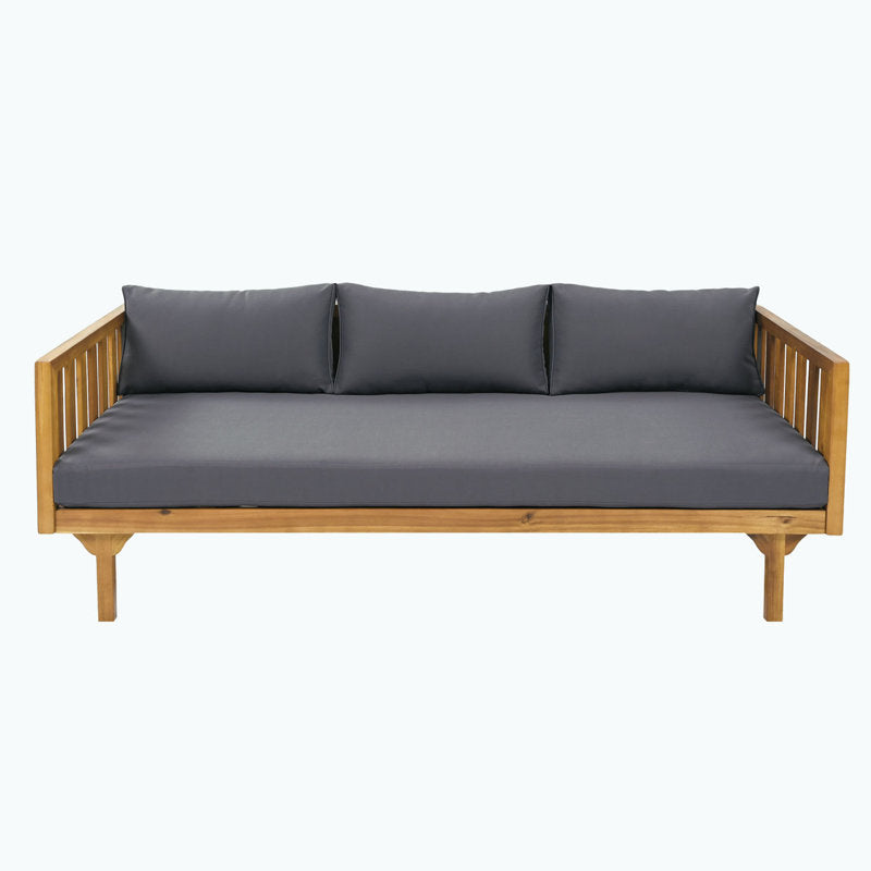 Elegant wooden sofa set with dark grey cushions and beige pillows
