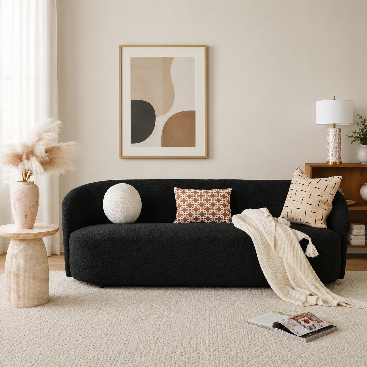 Curved black bouclé sofa with solid teak wood frame in modern living room