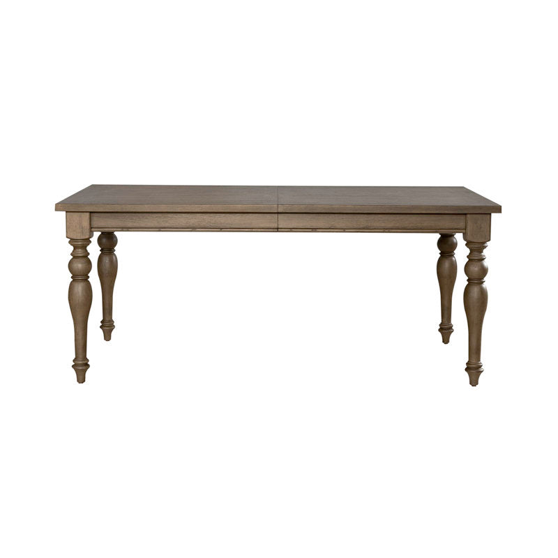 Neutral upholstered dining chairs with solid teak wood table