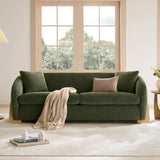 Contemporary green sofa with teak wood accents