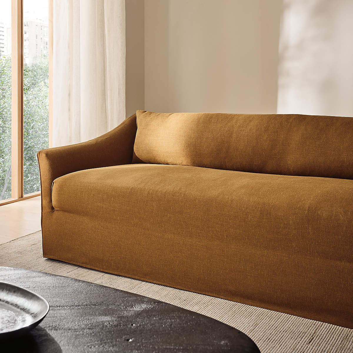 Designer living room sofa with curved armrests