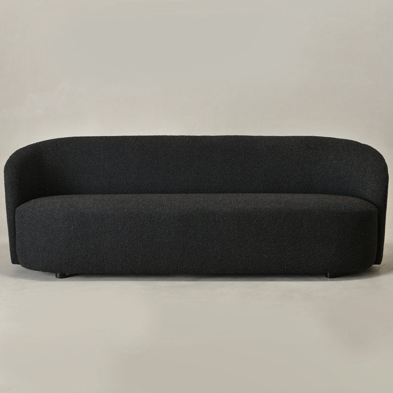 Modern curved black sofa in premium bouclé fabric
