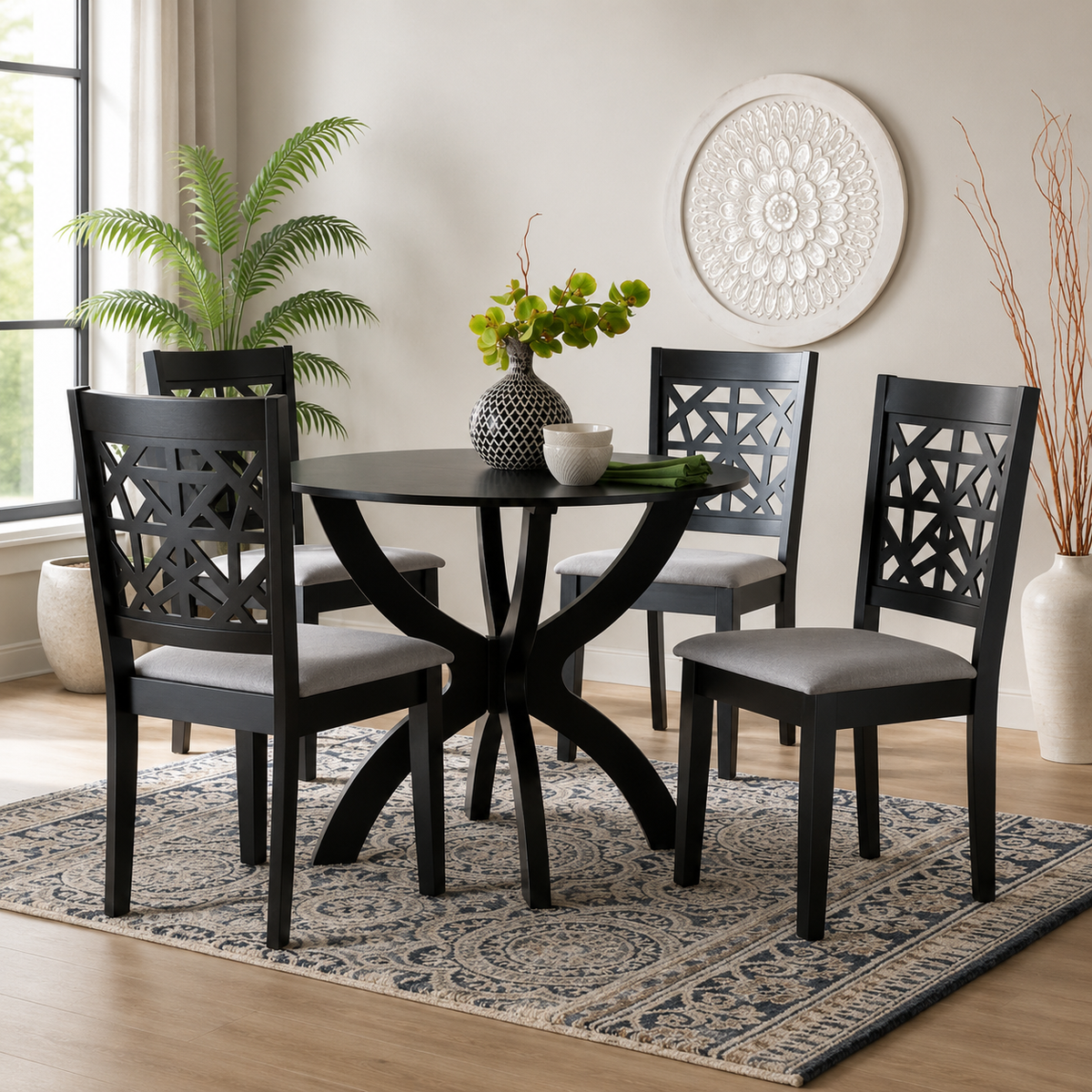 Modern black teak wood round dining table set with four upholstered chairs