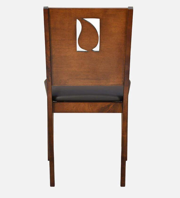 Rectangular wooden dining table with upholstered chairs