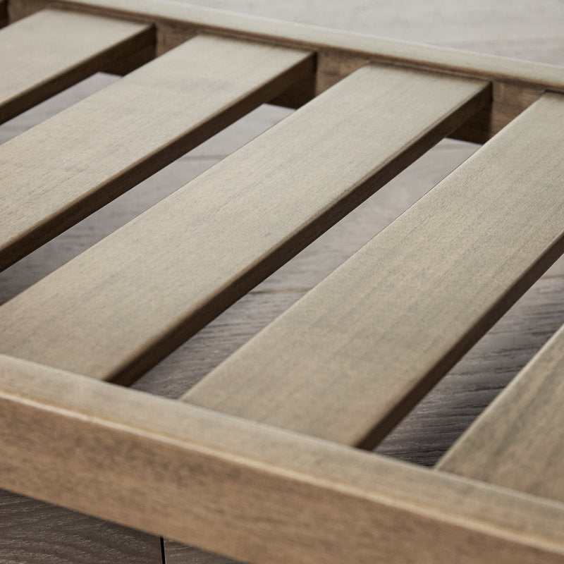 Upholstered entryway bench with storage rack