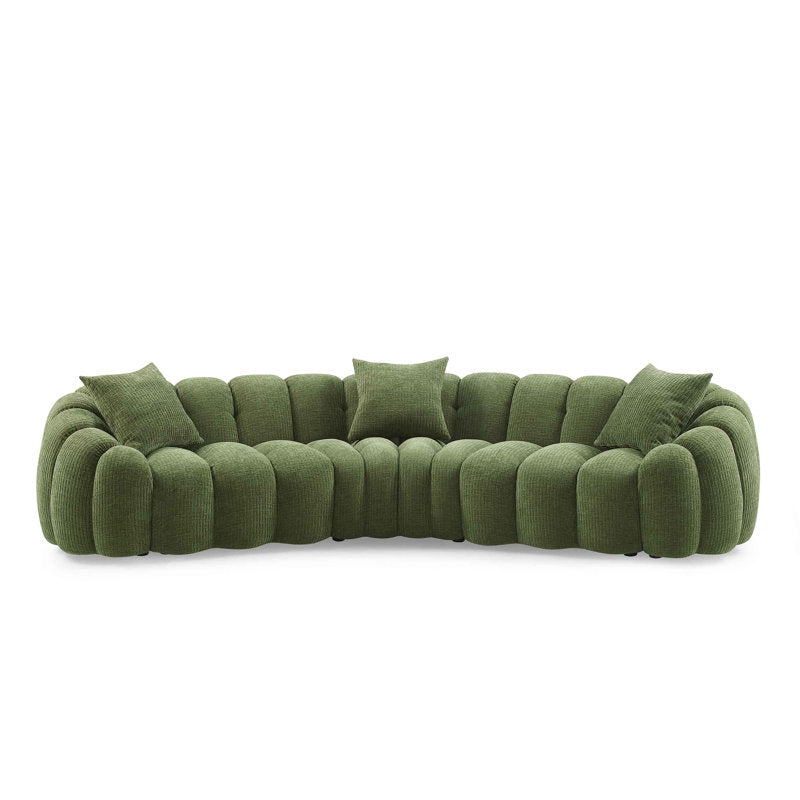 Designer curved green sofa with plush cushions and teak wood base